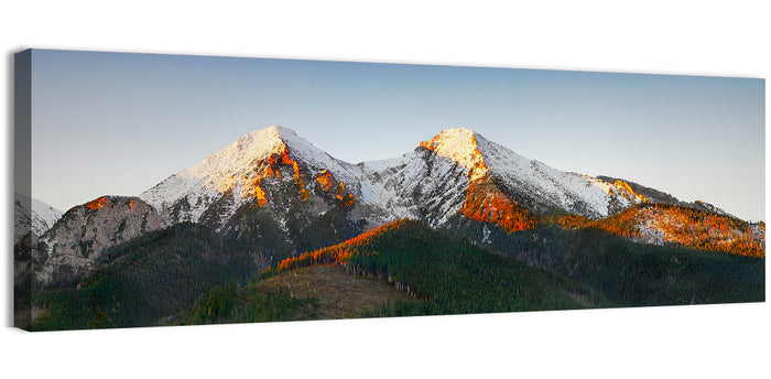 Sunlit Snow Capped Peaks Wall Art as a canvas print