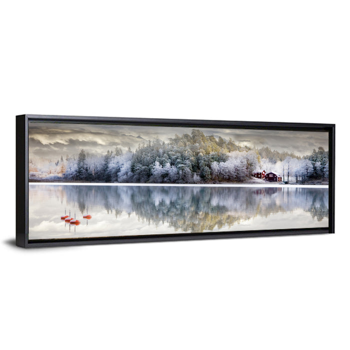 Red Cottage by a Frozen Lake Wall Art as a framed canvas