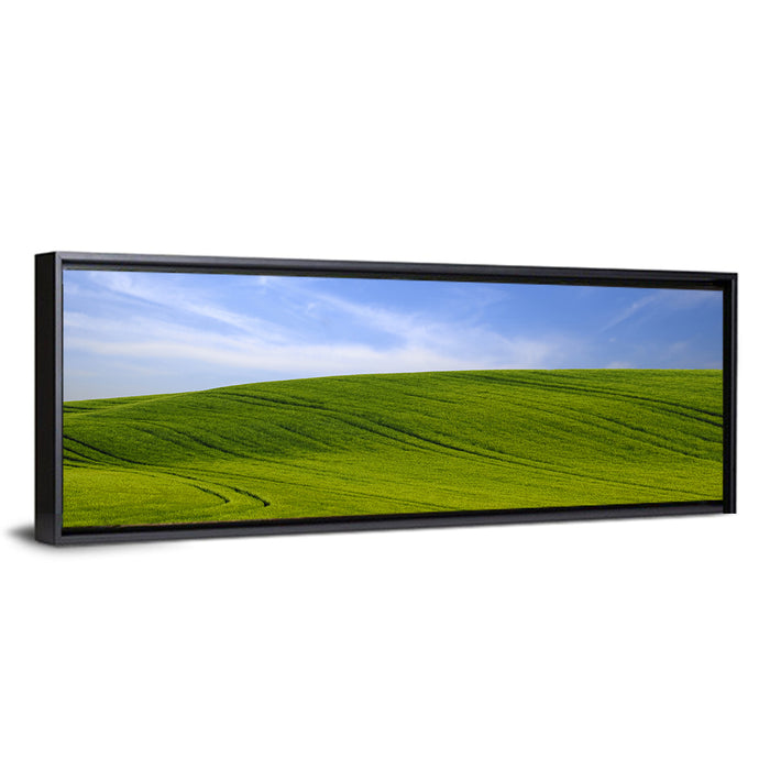 Rolling Green Hill with Blue Sky Wall Art as a framed canvas