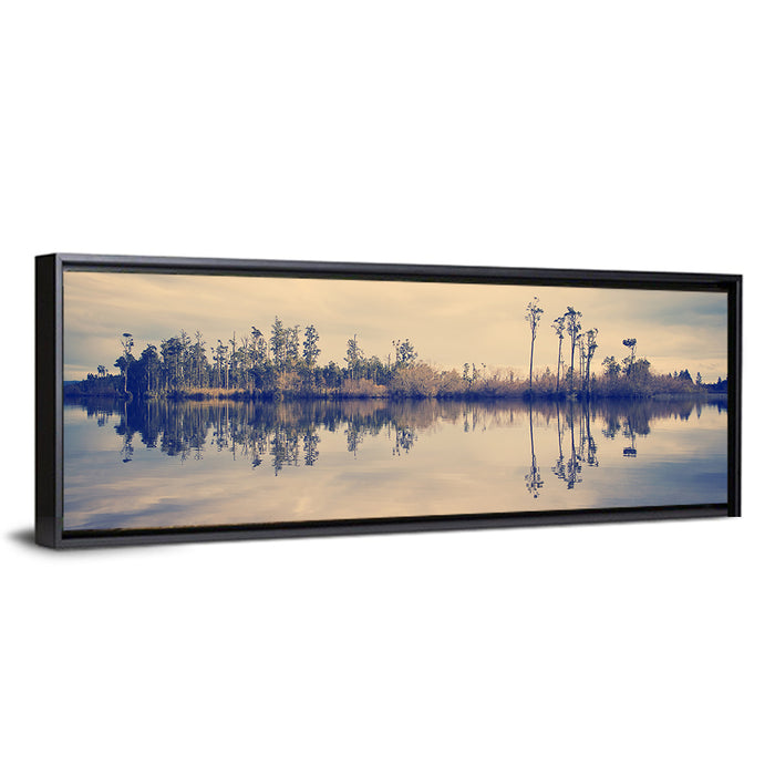Sunset Over Forest Lake Wall Art as a framed canvas