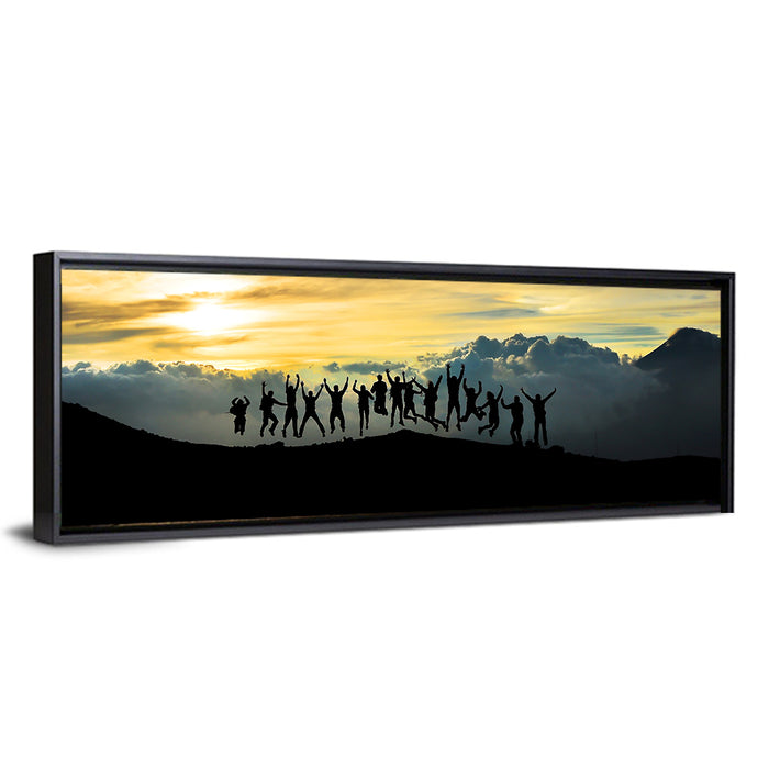 Golden Team Silhouettes at Sunset Wall Art as a framed canvas