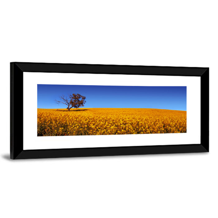 Canola Field with Lone Tree Wall Art as a framed print