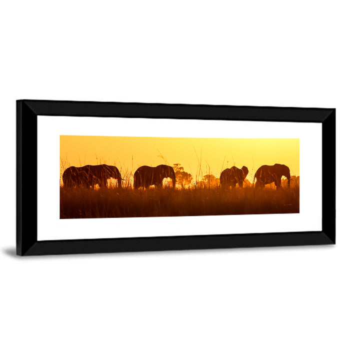 Golden Sunset Elephant Herd Wall Art as a framed print