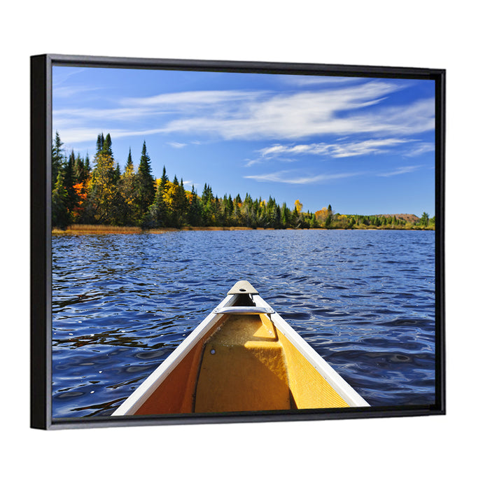 Yellow Canoe Bow on Blue Lake Wall Art as a framed canvas