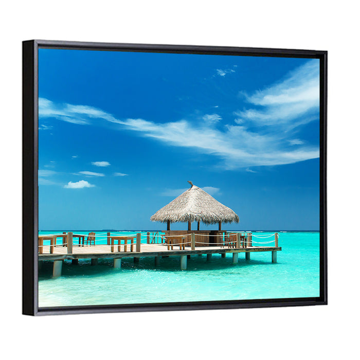 Thatched Beach Bar Pier Wall Art as a framed canvas