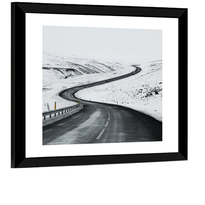 Winding Snow Road with Yellow Markers Wall Art as a framed print