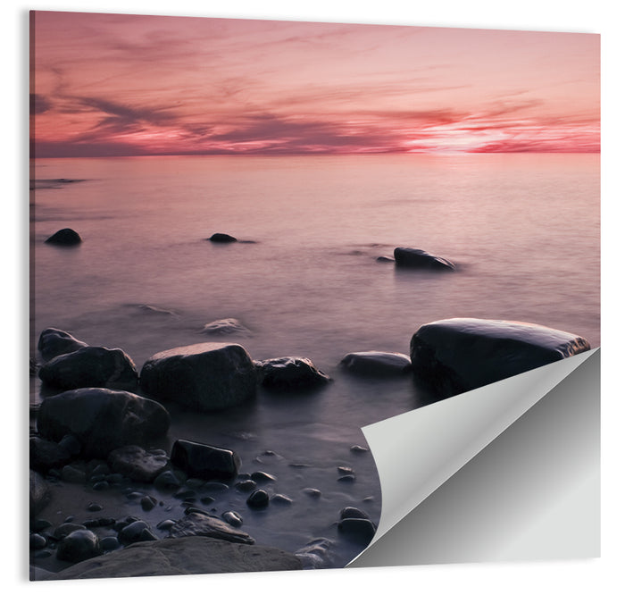 Pink Dusk Lakeshore with Silhouetted Rocks Wall Art as a poster print