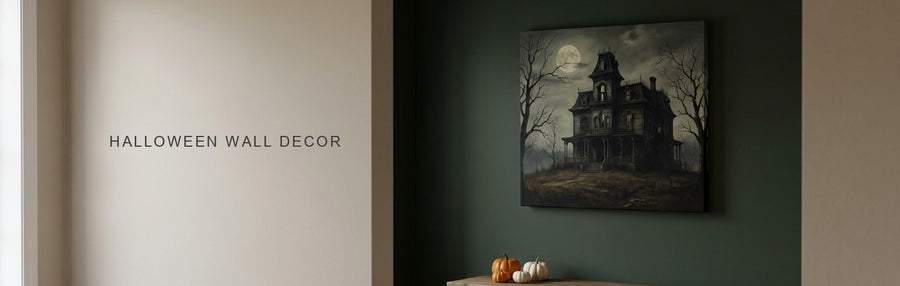 Halloween wall decor in a dark green entryway: a moonlit haunted house canvas above a console with small pumpkins