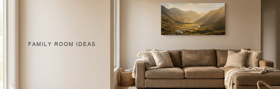 Family room ideas in a room with a large sectional sofa and wool rug under a wide national park valley canvas at golden hour