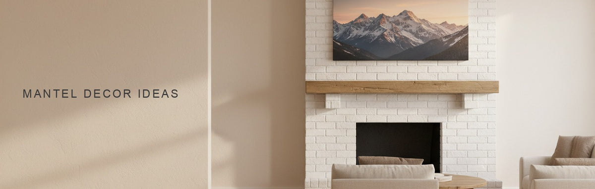 Mantel decor ideas in a living room with a white painted brick fireplace and wooden mantel: a snowy mountain range at sunrise above it