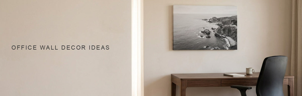 Office wall decor ideas in a home office with a walnut desk and task chair under a calm black and white aerial coastline canvas