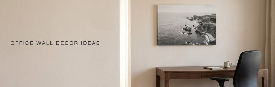 Office wall decor ideas in a home office with a walnut desk and task chair under a calm black and white aerial coastline canvas