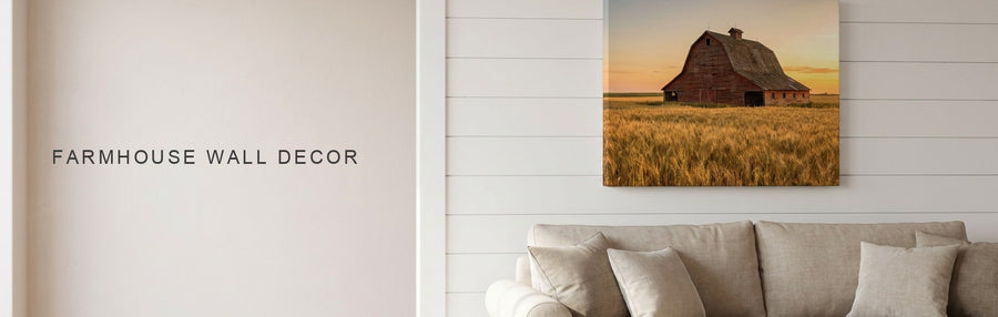 Farmhouse wall decor in a white shiplap living room with a linen sofa beneath a red barn in a golden wheat field canvas