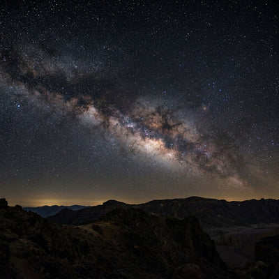 Milky Way wall art, the Milky Way arching over a mountain ridge at night