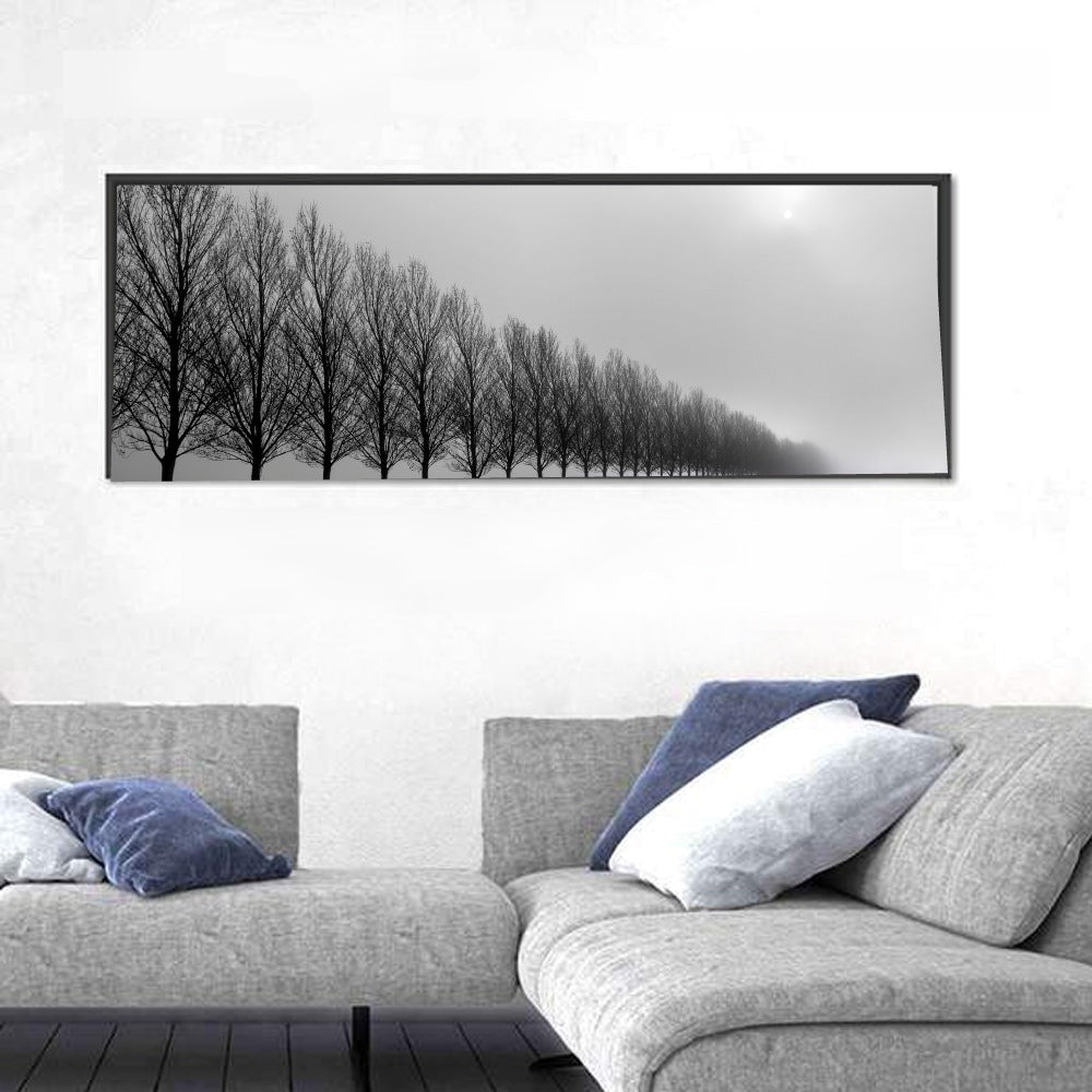 Misty Row of Bare Trees Wall Art in a room, panoramic