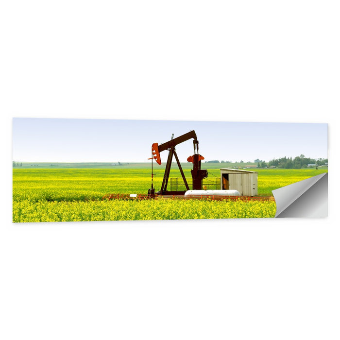 Rusty Pumpjack in Yellow Canola Field Wall Art as a poster print