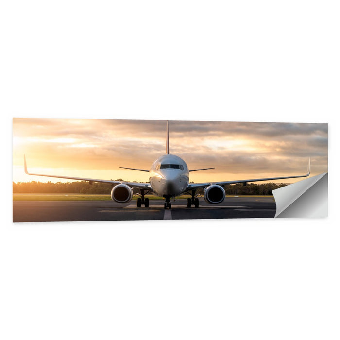 Front Facing Airplane on Runway at Sunset Wall Art as a poster print