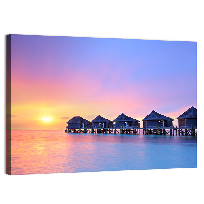 Maldives Sunset Over Water Bungalows Wall Art as a canvas print