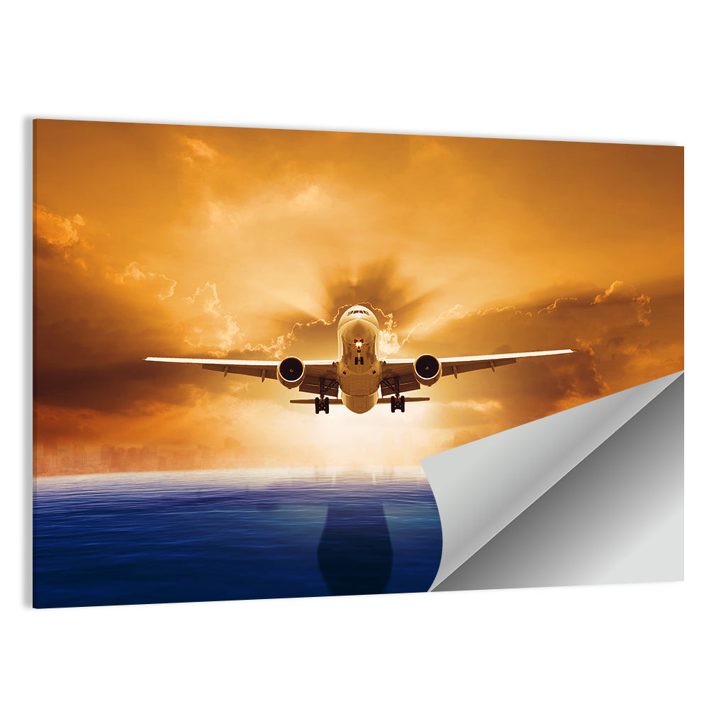 Landing Jet Over Ocean at Sunset Wall Art