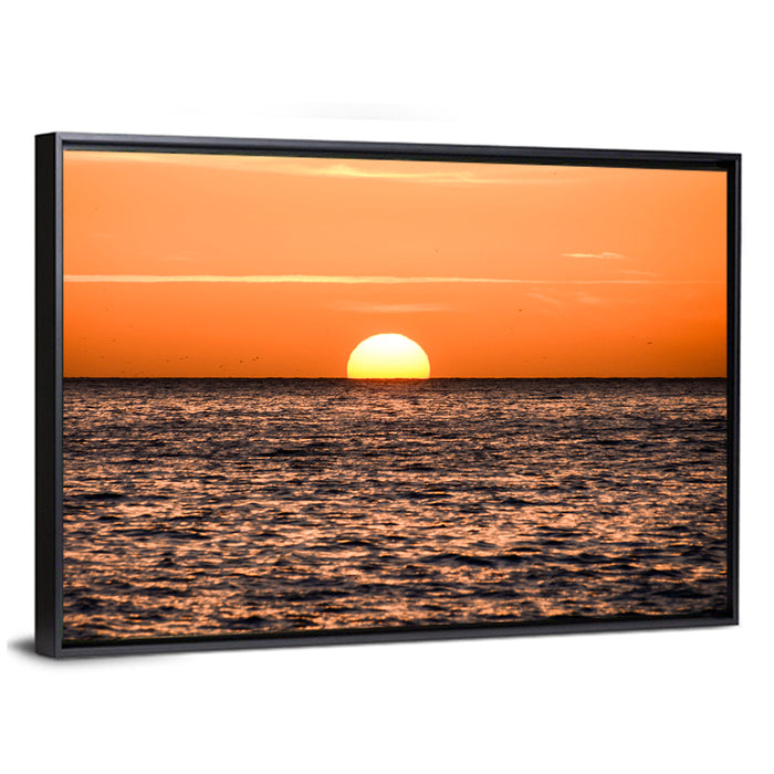 Sunset Over Open Ocean Wall Art as a framed canvas