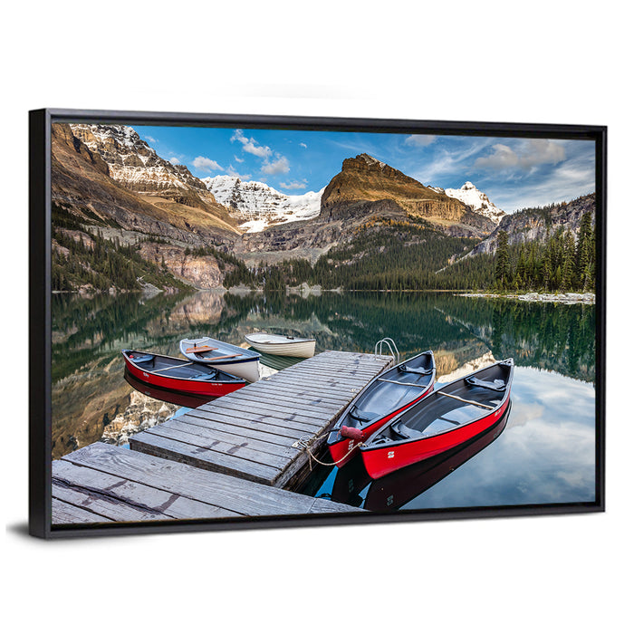 Canadian Rockies Lake with Red Canoes Wall Art as a framed canvas