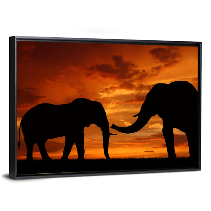 Elephants at Golden Sunset Wall Art as a framed canvas