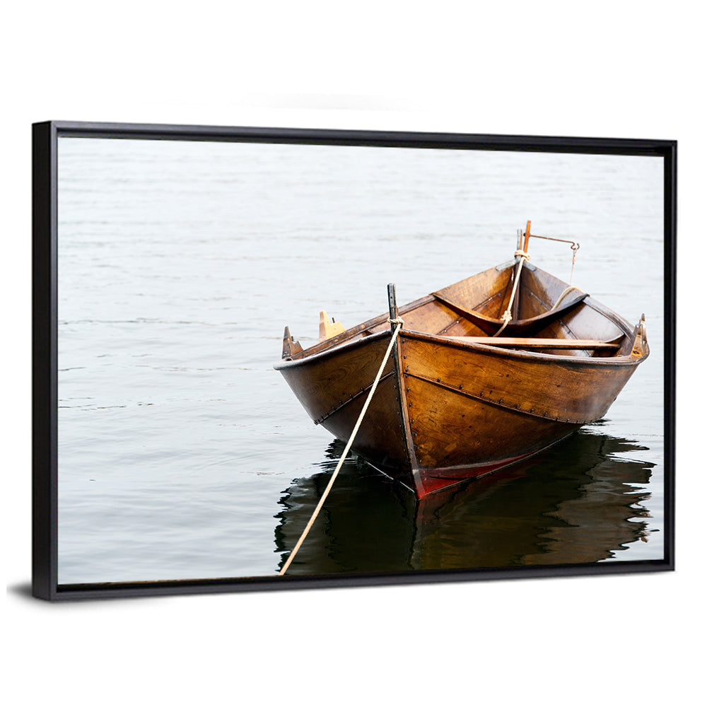Tethered Wooden Rowboat on Calm Water Wall Art
