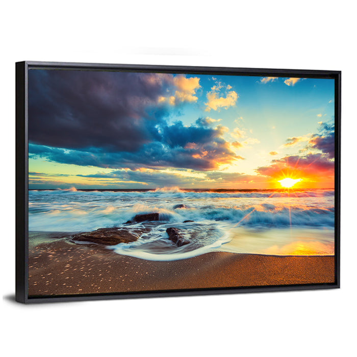 Sunrise Cloudscape Over Rocky Shore Wall Art as a framed canvas