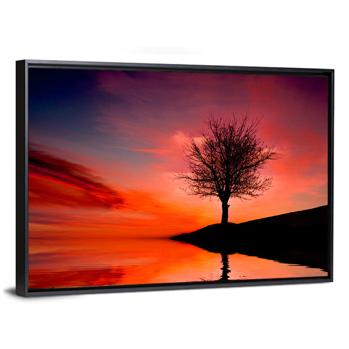 Leafless Tree Reflected on Lake Wall Art as a framed canvas