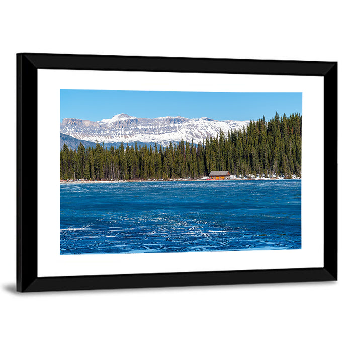 Boathouse on Frozen Lake Louise Wall Art as a framed print