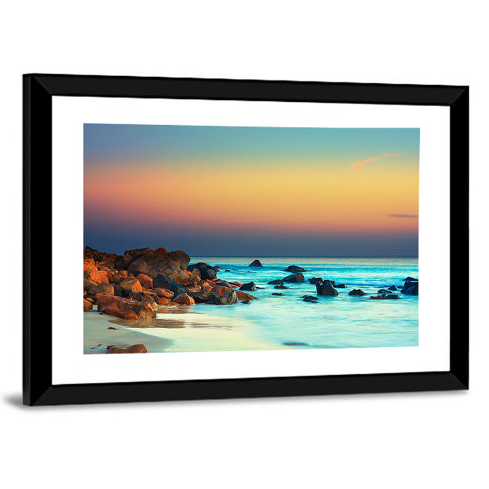 Sunset Over Volcanic Shoreline Wall Art as a framed print
