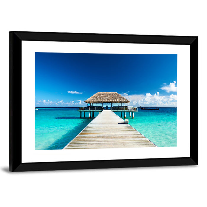 Maldives Wooden Jetty Over Turquoise Water Wall Art as a framed print