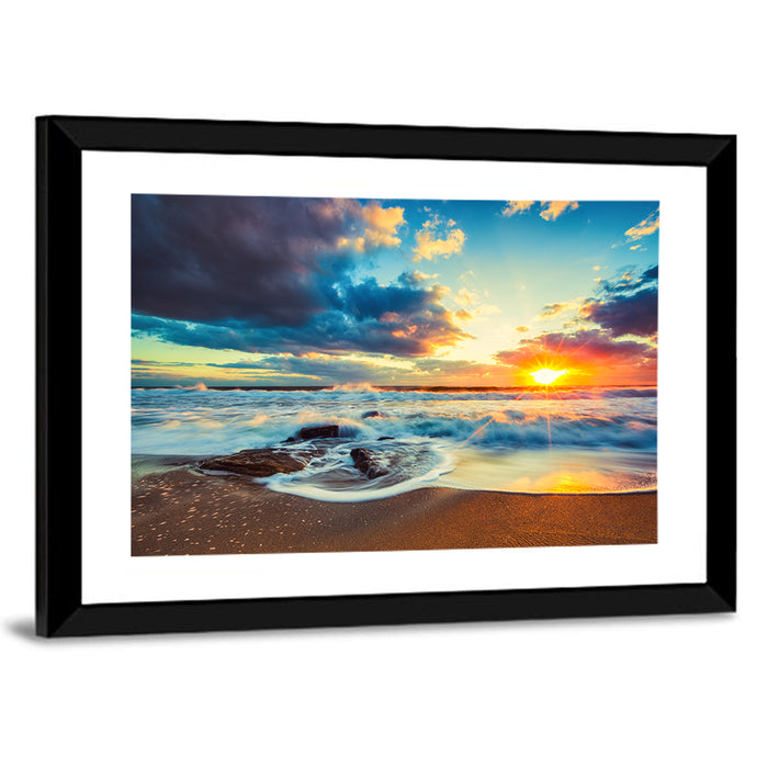 Sunrise Cloudscape Over Rocky Shore Wall Art as a framed print
