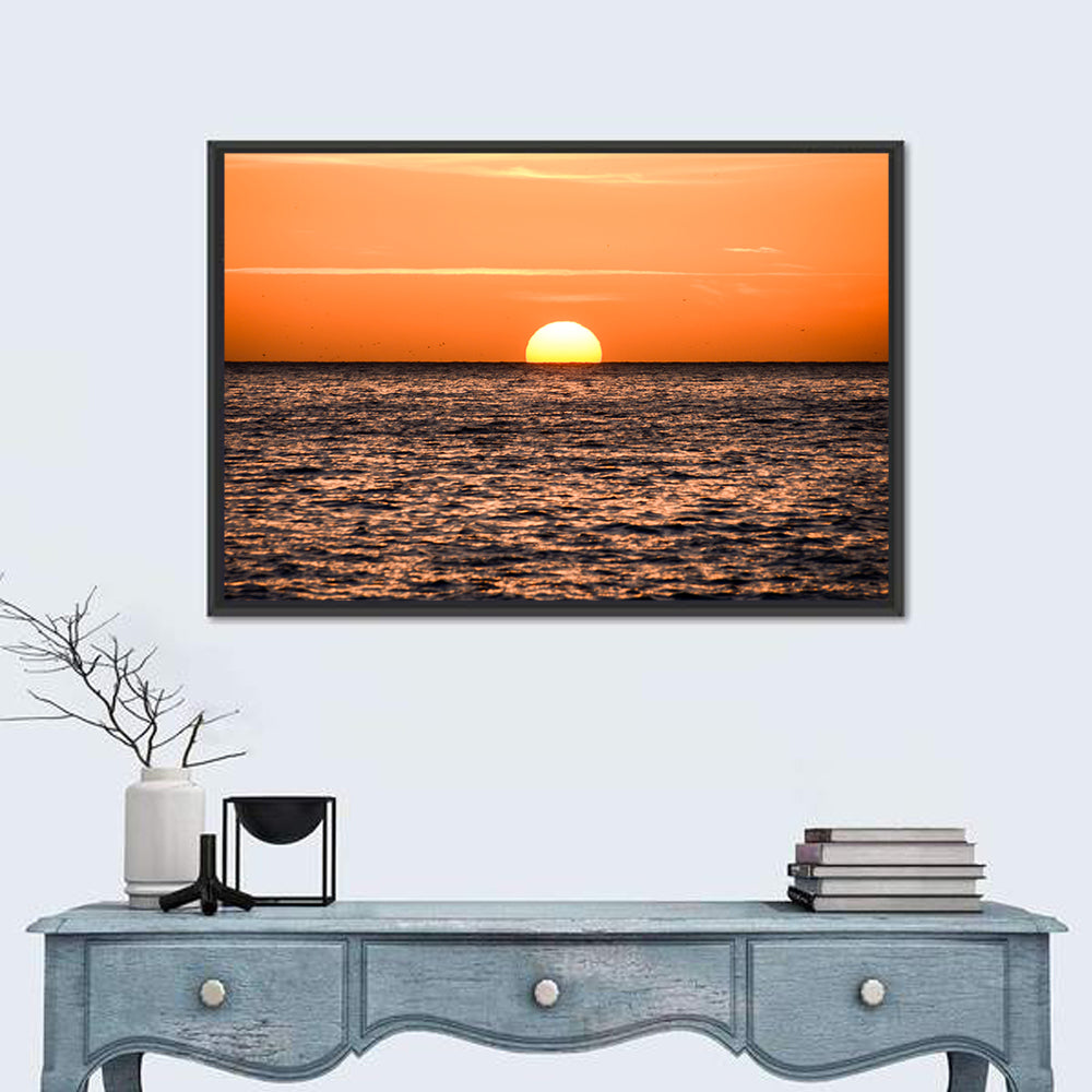 Sunset Over Open Ocean Wall Art in a room, landscape