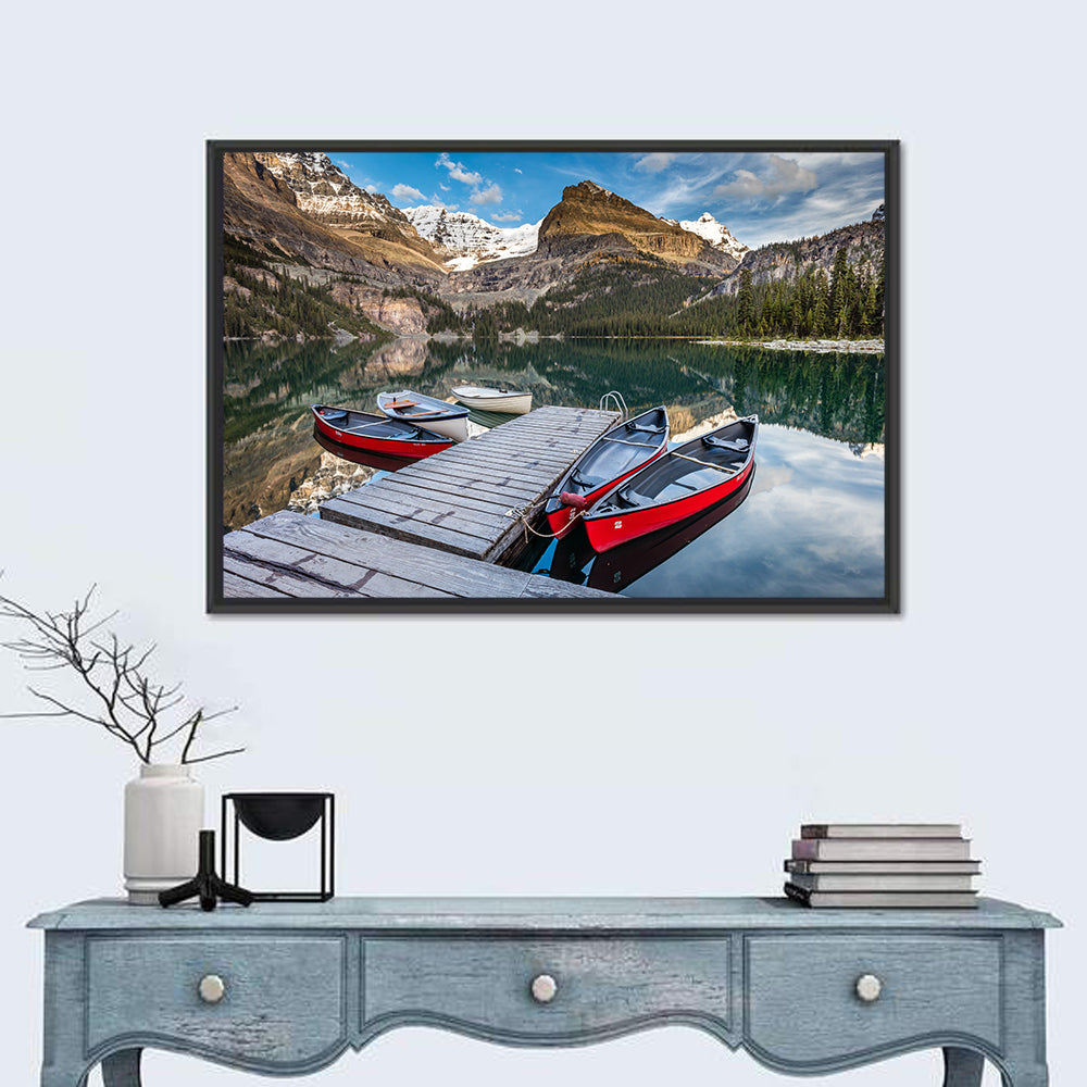Canadian Rockies Lake with Red Canoes Wall Art in a room, landscape