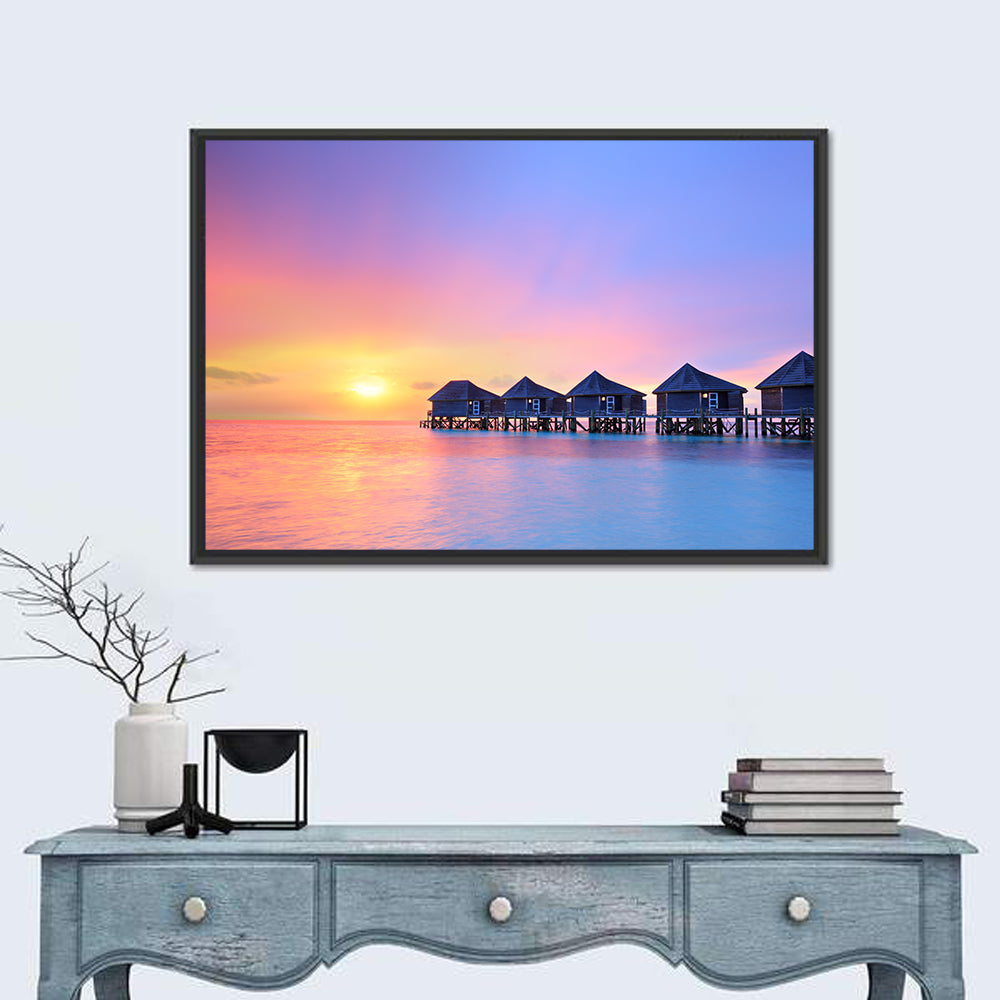 Maldives Sunset Over Water Bungalows Wall Art in a room, landscape