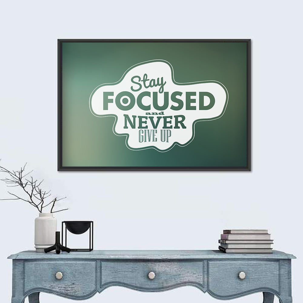 Stay Focused Never Give Up Typography Wall Art in a room, landscape