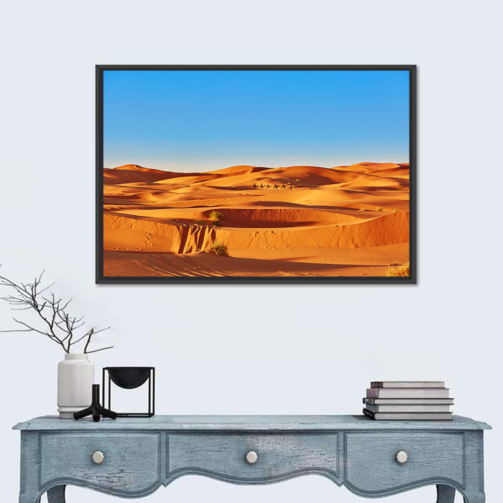 Sunlit Sahara Dunes with Camel Caravan Wall Art in a room, landscape