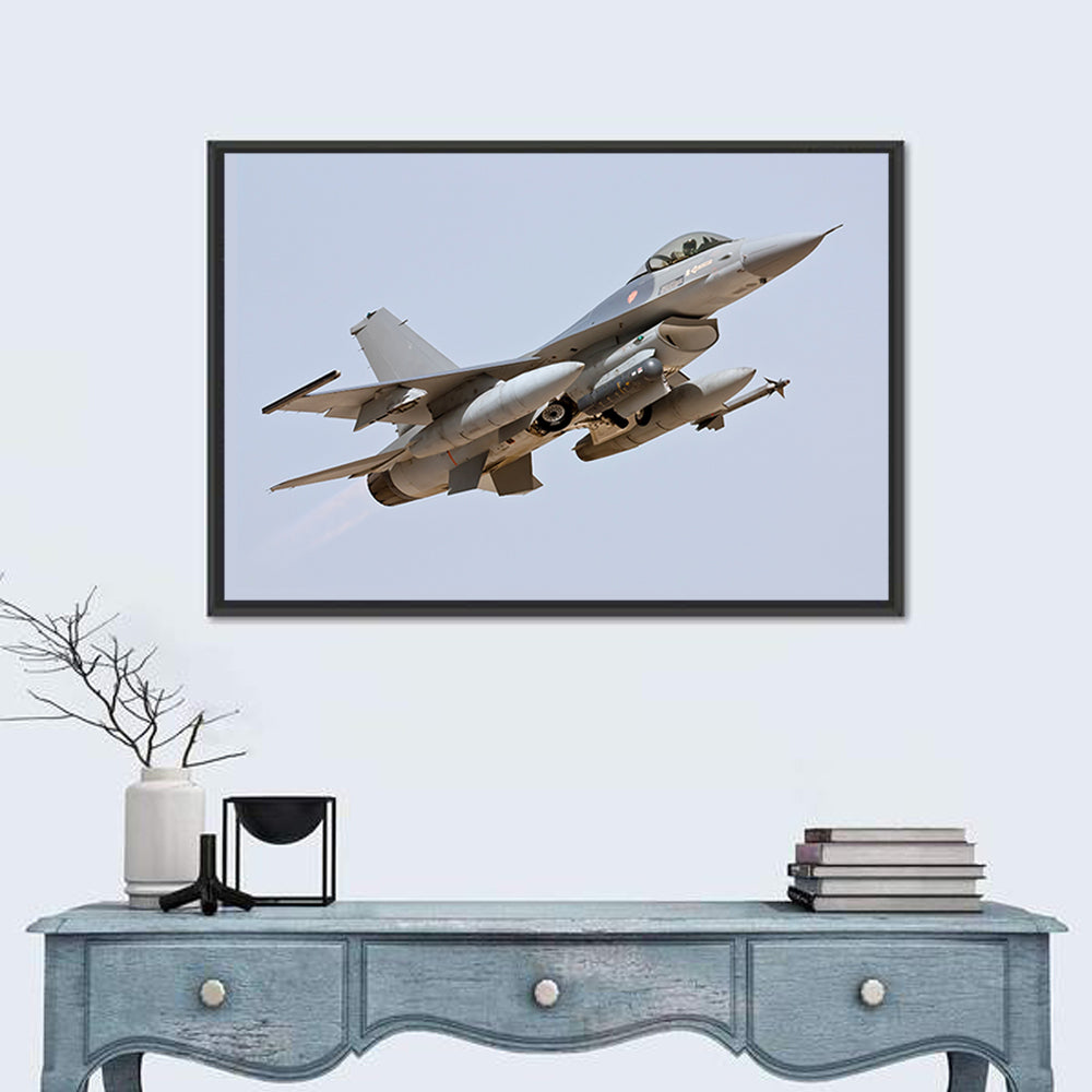 F-16 Fighter Jet Banking Over Sky Wall Art in a room, landscape
