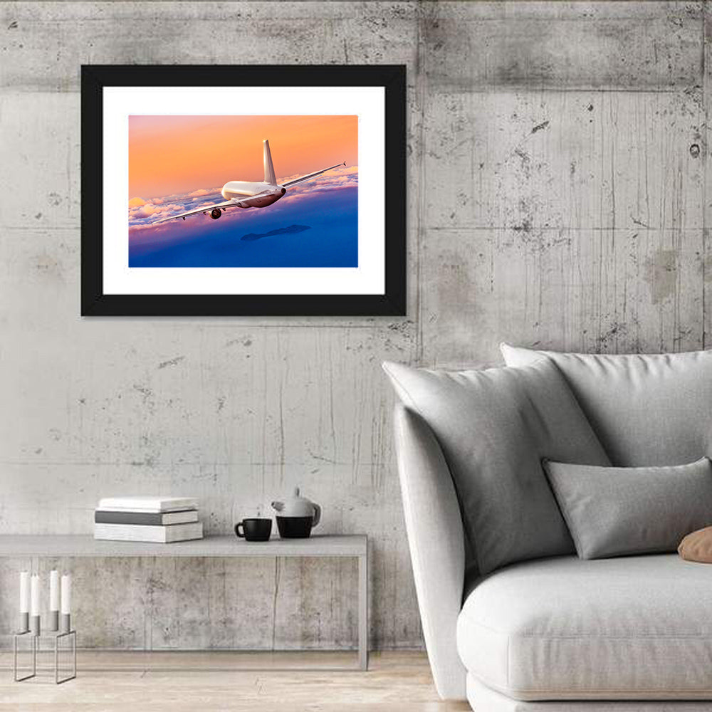 Airplane Over Clouds at Sunset Wall Art