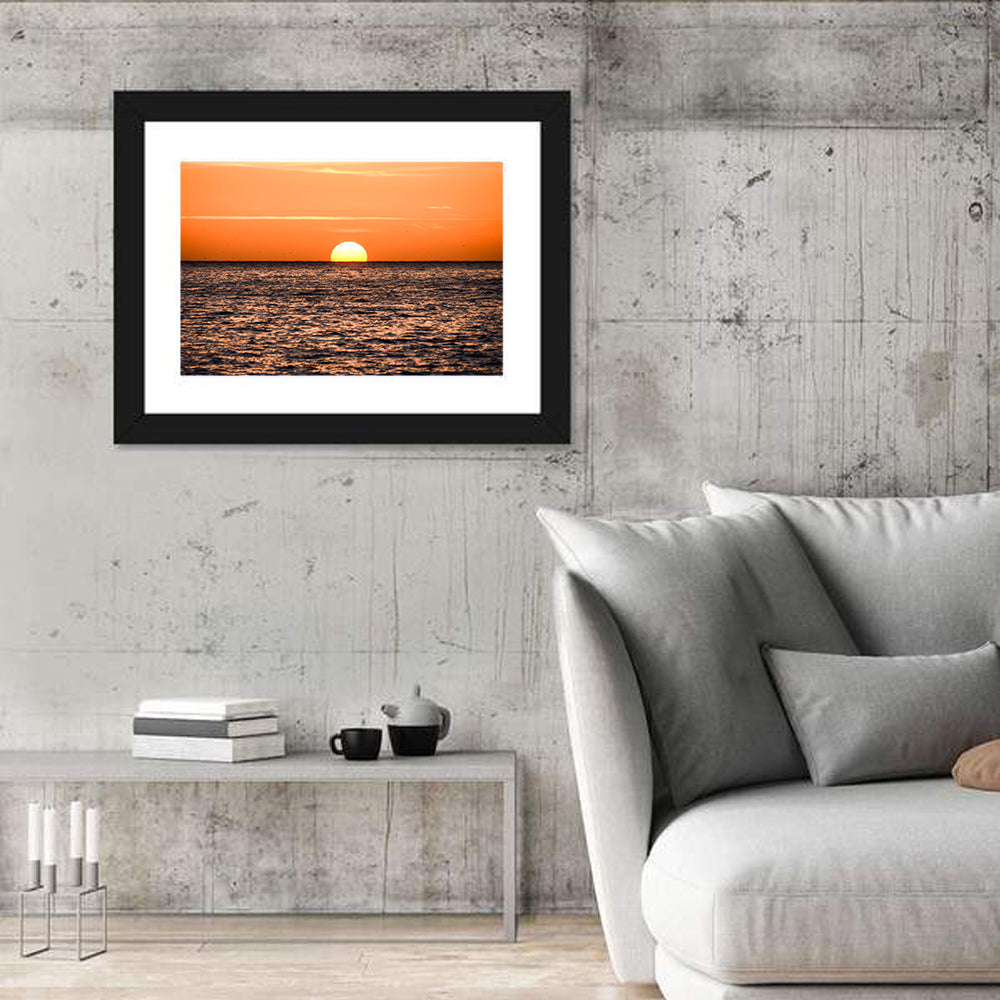 Sunset Over Open Ocean Wall Art in a room, landscape