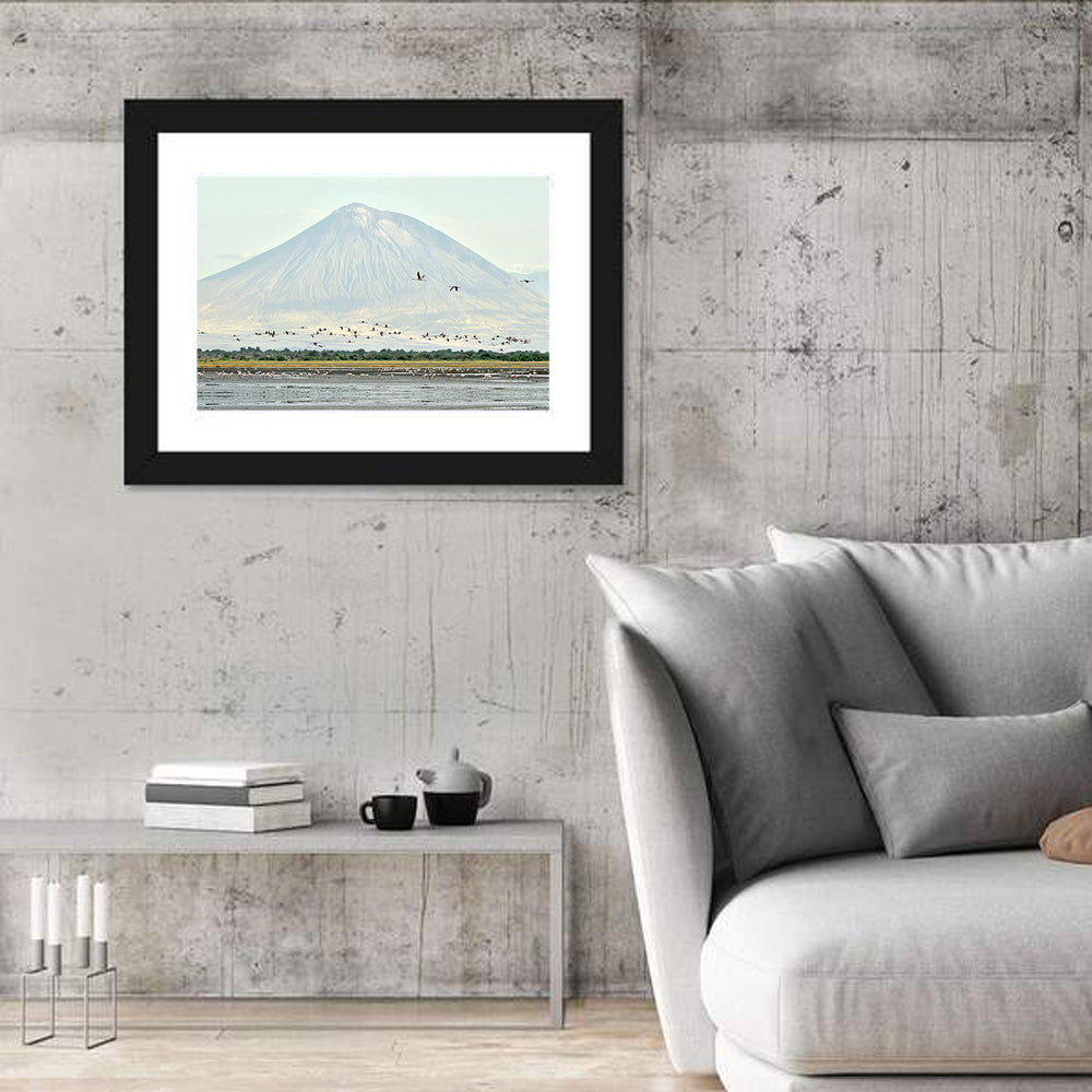 Flamingos Over Lake Natron, Doinyo Lengai Wall Art in a room, landscape