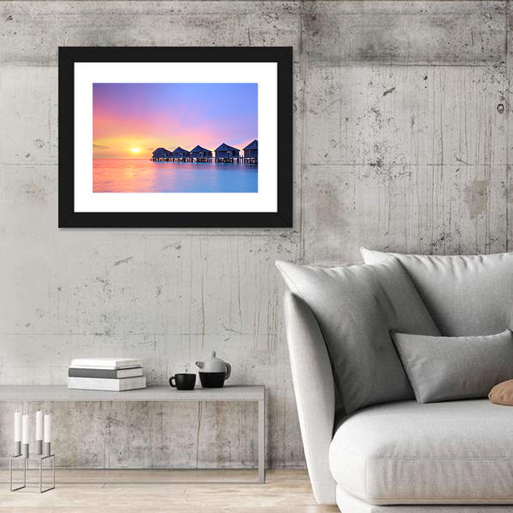 Maldives Sunset Over Water Bungalows Wall Art in a room, landscape