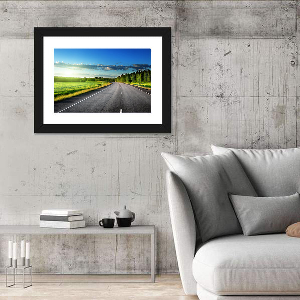Curved Asphalt Road Through Forest Wall Art in a room, landscape
