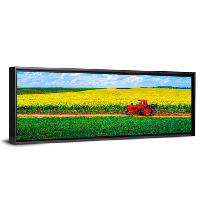 Red Tractor Over Yellow Rapeseed Field Wall Art as a framed canvas