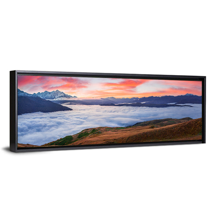 Mt Tetnuld Sunrise Over Clouds Wall Art as a framed canvas