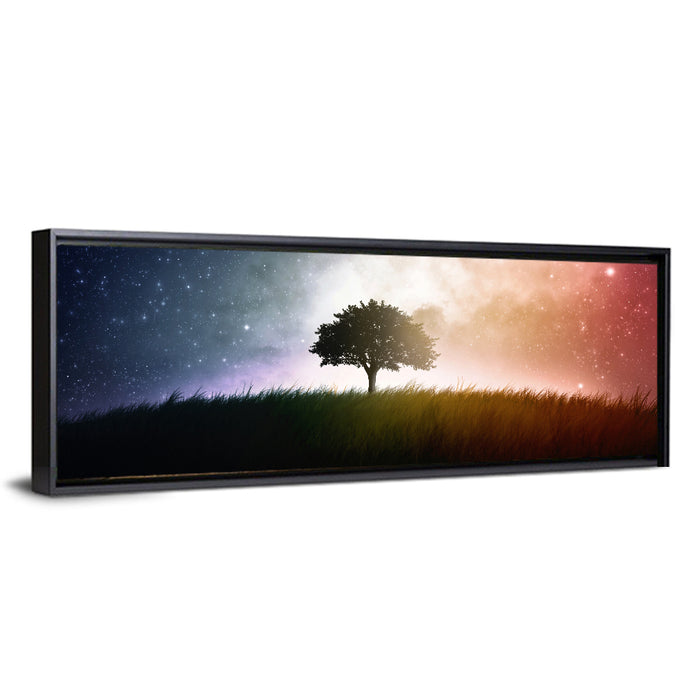 Tree Silhouette Under Nebula Sky Wall Art as a framed canvas