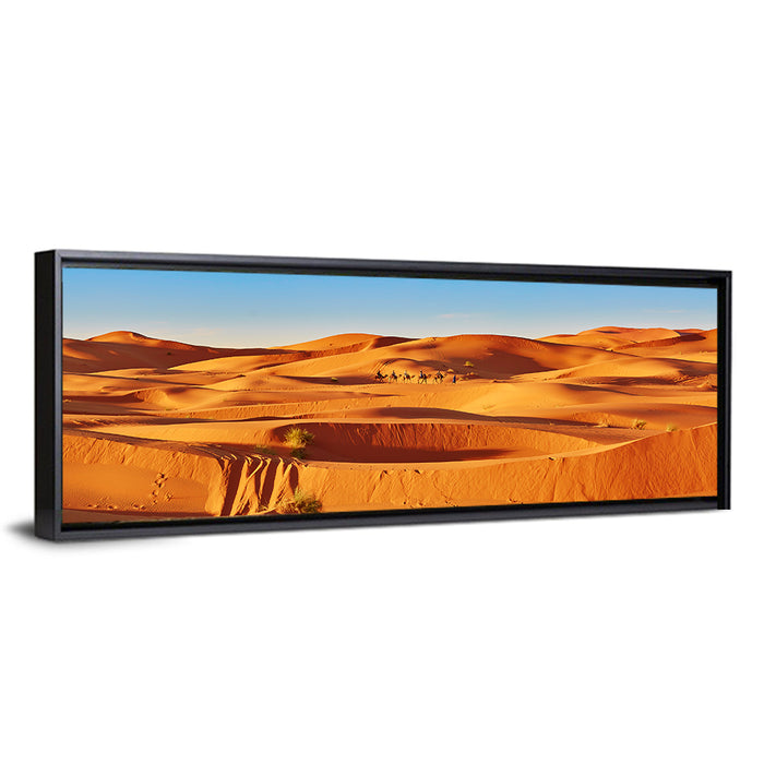 Sunlit Sahara Dunes with Camel Caravan Wall Art as a framed canvas
