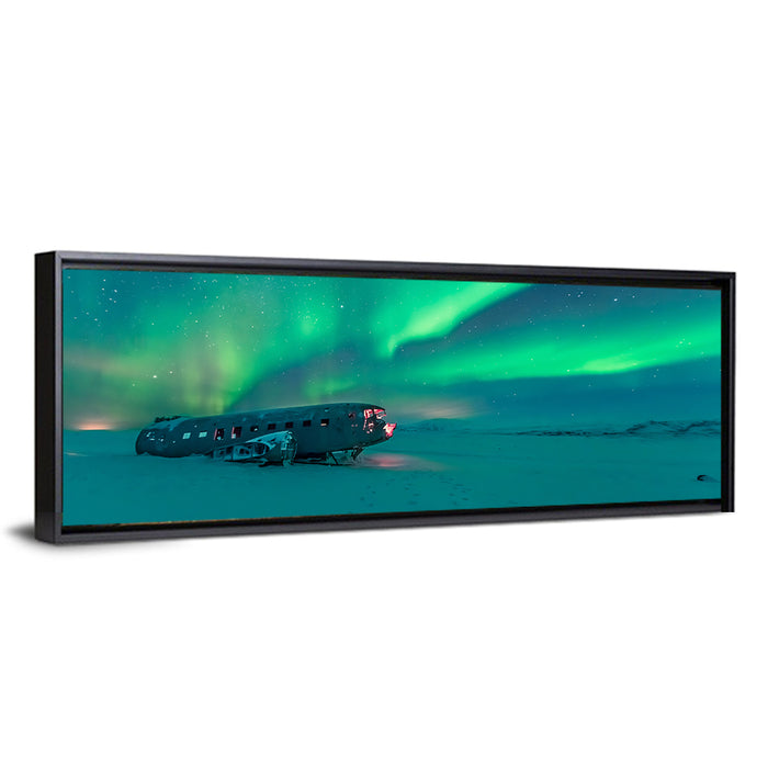 Northern Lights Over Sólheimasandur Wreck Wall Art as a framed canvas