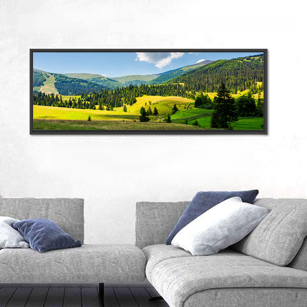 Sunlit Haystacks on Rolling Grassy Hills Wall Art in a room, panoramic